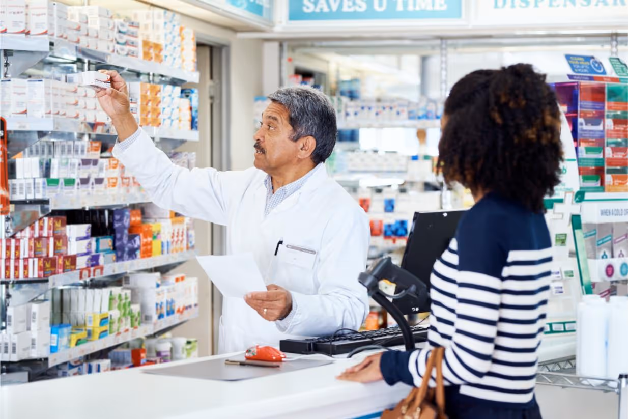 Pharmacist serving a patient